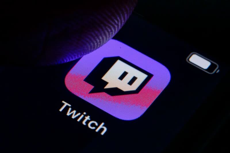 BERLIN, GERMANY - OCTOBER 11: In this photo illustration the logo of live streaming video platform Twitch is displayed on a smartphone on October 11, 2019 in Berlin, Germany. (Photo Illustration by Thomas Trutschel/Photothek via Getty Images)