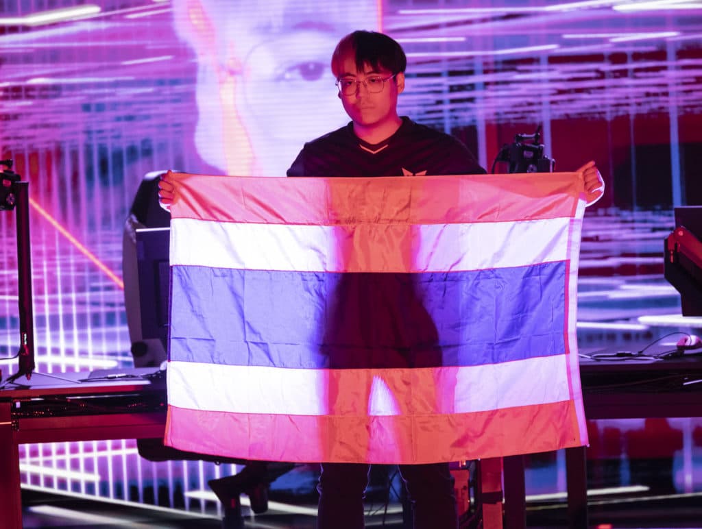 REYKJAVIK, ICELAND - APRIL 13: Thanamethk "Crws" Mahatthananuyut of XERXIA holds the flag of Thailand at the VALORANT Masters Groups Stage on April 13, 2022 in Reykjavik, Iceland. (Photo by Colin Young-Wolff/Riot Games)<br>