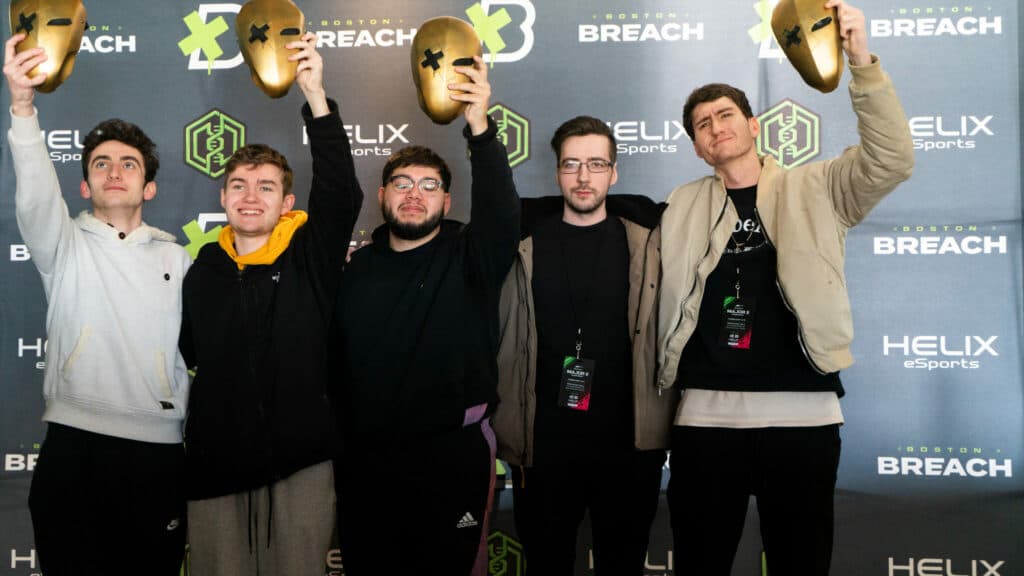 The Decimate Gaming roster holding up their Breach Mask trophies at the end of the event in Boston. Photo via Ant Stonelake.