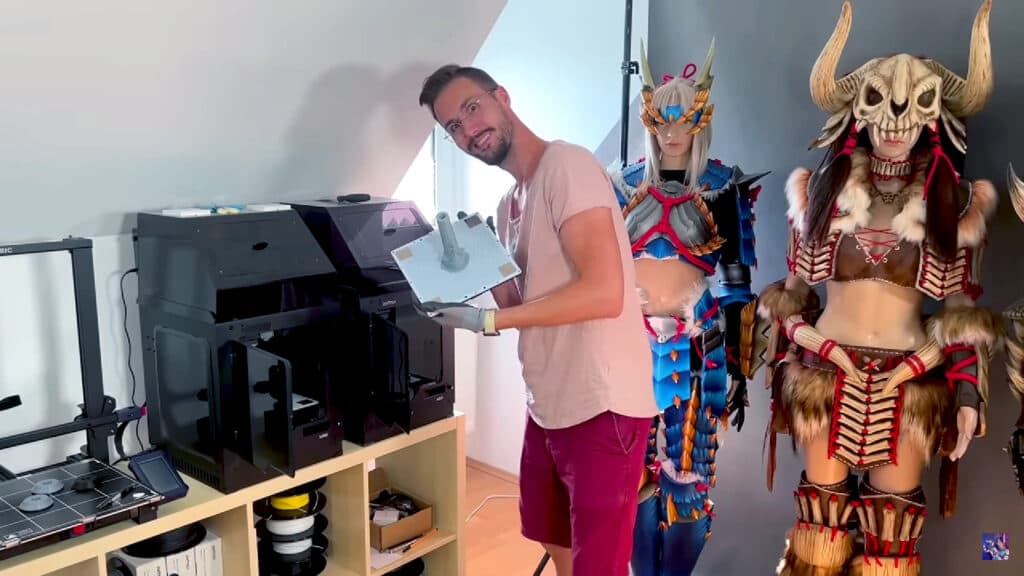 Printing the models using a 3D printer (Image from <a href="https://www.youtube.com/watch?v=Xhl5oUL5g3c" target="_blank" rel="noreferrer noopener">KamuiCosplay</a>)