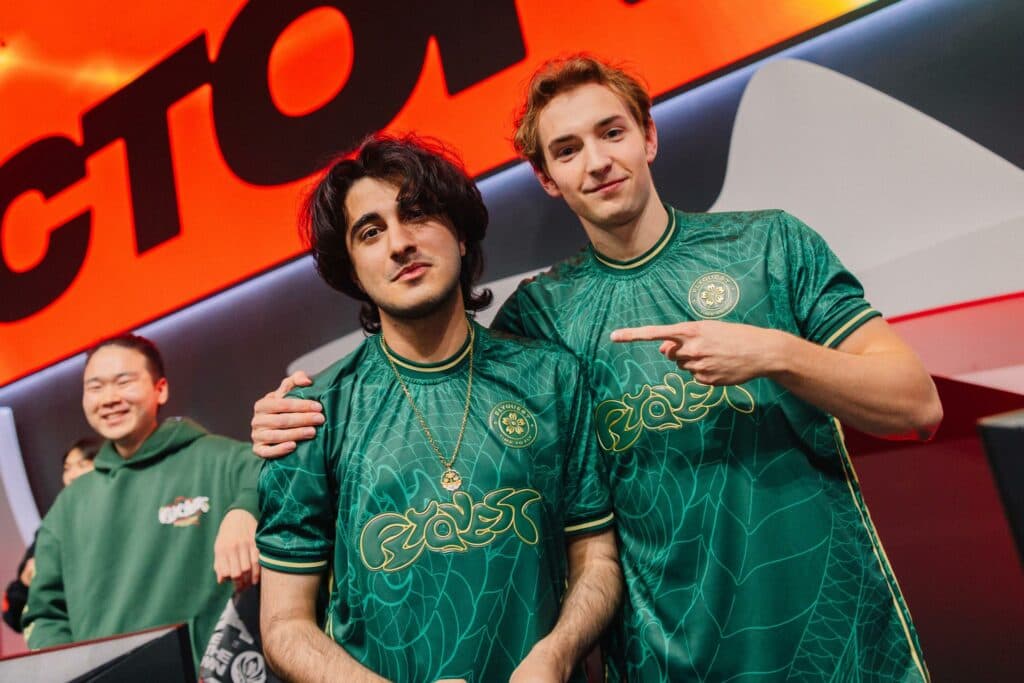 Fahad "Massu" Abdulmalek (L) and Alan "Busio" Cwalina of FlyQuest are seen on stage after victory during MSI Play-Ins at the Chengdu Financial City Performing Arts Center in Chengdu, China on May 01, 2024 (Image via Colin Young-Wolff/Riot Games)