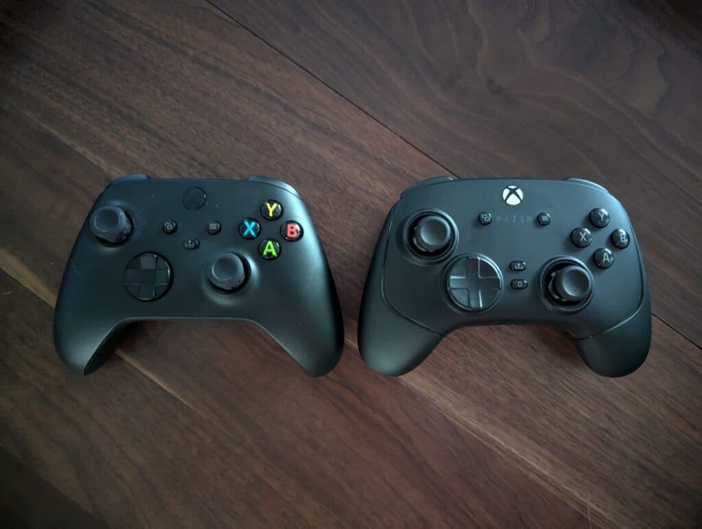 The Wolverine V3 Pro next to a standard issue Xbox controller (Image via esports.gg)