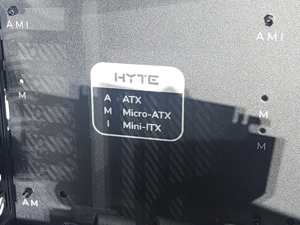 The guides on the HYTE Y70 Persona 3 Reload case, denoting which holes are needed by which motherboard form factor (Photo via esports.gg)