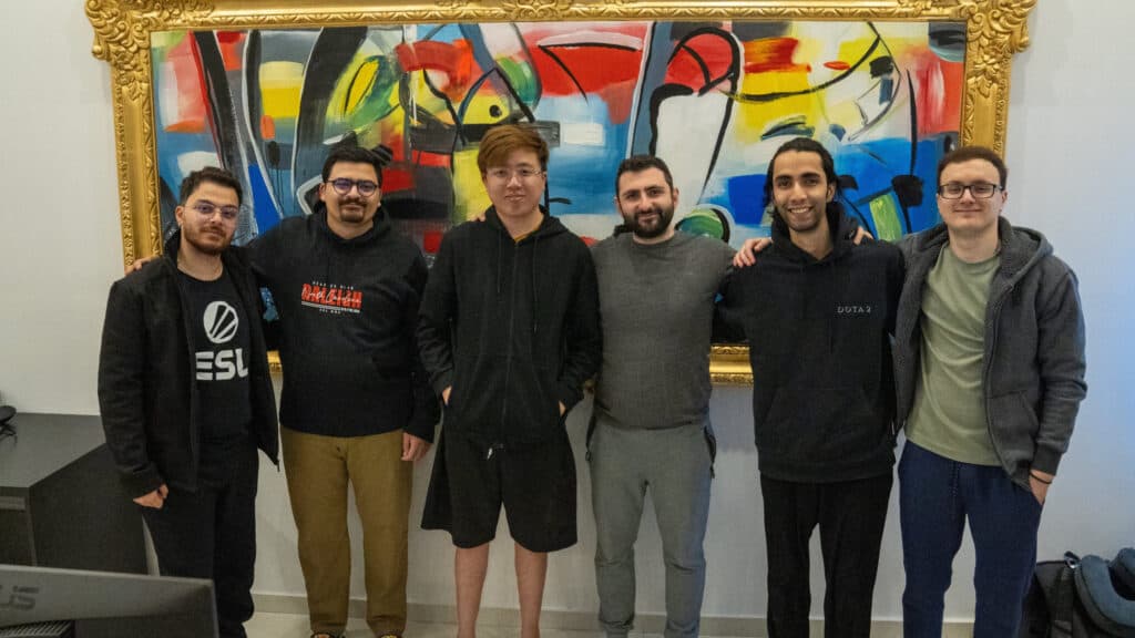 Miracle (right) appears in good spirits with the squad (Image via Nigma Galaxy)