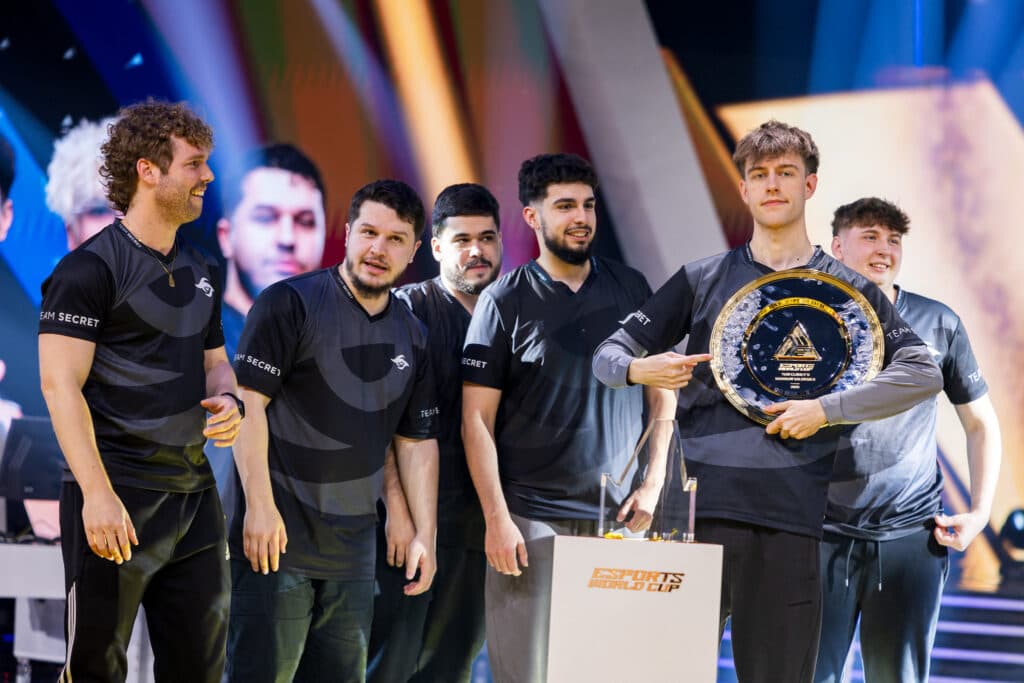 R6 Team Secret with the EWC 2025 trophy (photo by Esports World Cup | Wojciech Wandzel)