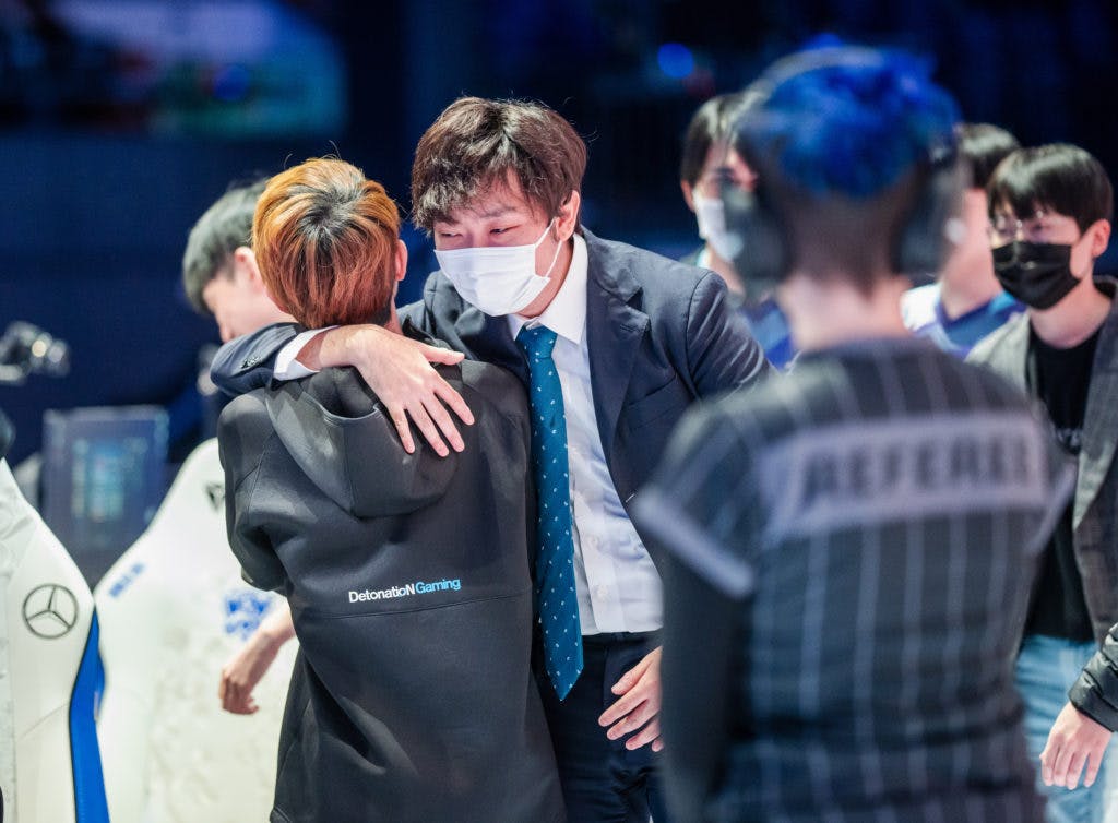 REYKJAVIK, ICELAND - OCTOBER 7: DetonatioN FocusMe's coach Kazuta "Kazu" Suzuki (R) and Shunsuke "Evi" Murase react after the victory match at the League of Legends World Championship Play-Ins Stage on October 7, 2021 in Reykjavik, Iceland. (Photo by Michal Konkol/Riot Games)