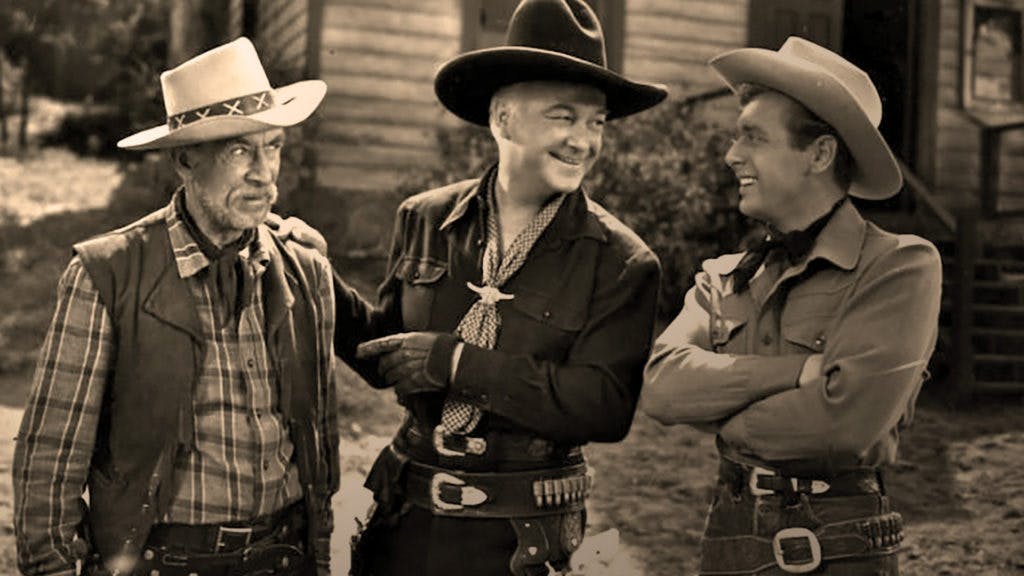Hopalong Cassidy, no meio da foto, era um personagem e caubói popular no começo do século XX.