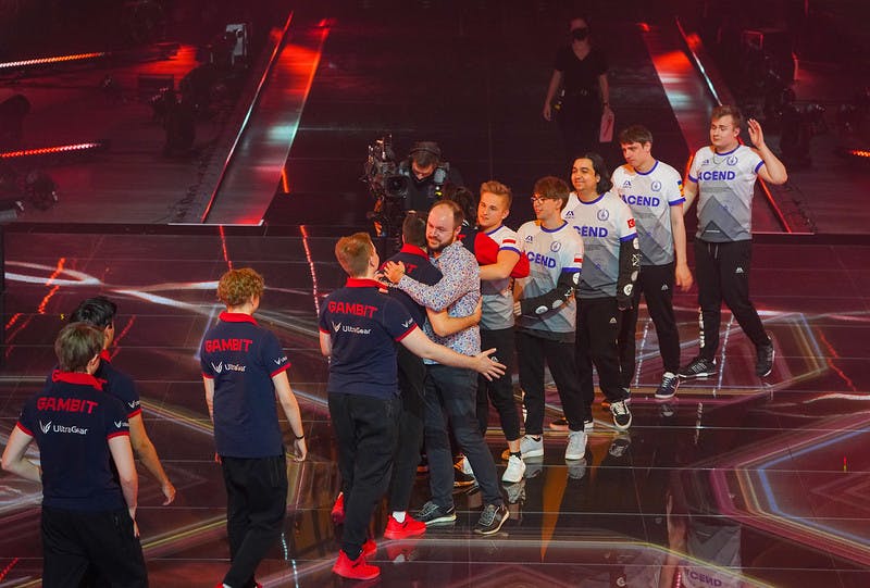 BERLIN, GERMANY - DECEMBER 12: Team Gambit Esports (L) and team Acend greet each other on stage at the conclusion of the VALORANT Champions Finals on December 12, 2021 in Berlin, Germany.(Photo by Wojciech Wandzel/Riot Games)