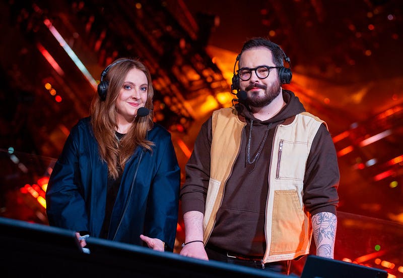 BERLIN, GERMANY - DECEMBER 12: Commentators and analysts Lauren "Pansy" Scott (L) and Michael "hypoc" Robins pose at the VALORANT Champions Finals on December 12, 2021 in Berlin, Germany. (Photo by Michal Konkol/Riot Games)