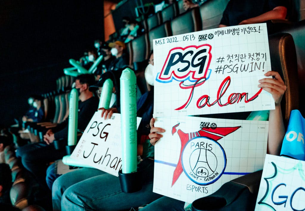 (RIOT GAMES/Lee Aiksoon) Fans hold up PSG Talon signs at the Busan Esports Arena in South Korea.