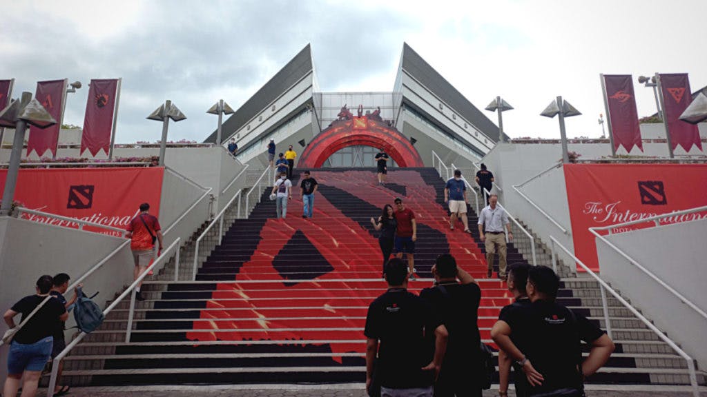 The stairs showing the Dota 2 logo lead up to the stadium.