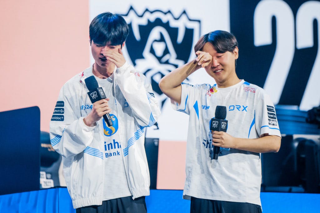 NEW YORK, NEW YORK - OCTOBER 23: Kim "Deft" Hyuk-kyu (L) and Hong "Pyosik" Chang-hyeon of DRX react onstage after victory against Edward Gaming at the League of Legends World Championship Quarterfinals on October 23, 2022 in New York City. (Photo by Colin Young-Wolff/Riot Games)