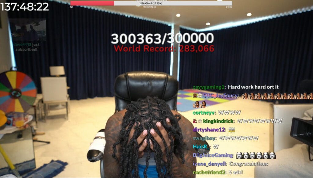Passing 300k subs was a clearly emotional moment for Cenat, who took time to digest the milestone. Screenshot from Kai Cenat's Twitch channel.