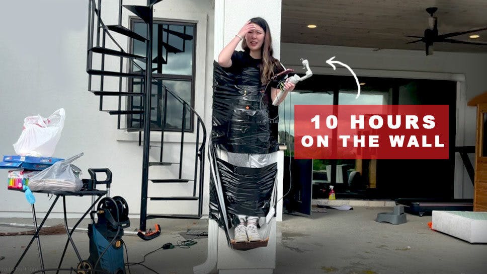 ExtraEmily tapes herself to the wall for 10 hours during her Wall-A-Thon cover image