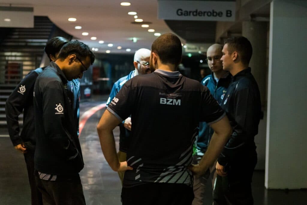 MC is a big BZM fan, going so far to wear his shirt at the Berlin Major (Image via OG)