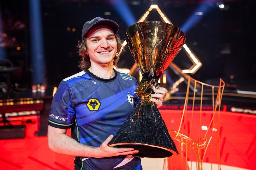 Zikz posing with Evil Geniuses' VALORANT Champions 2023 trophy (Photo by Colin Young-Wolff/Riot Games)