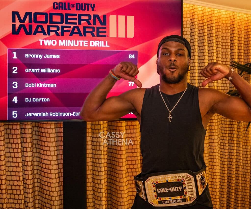 Bronny James posing with the custom champion's belt (Image via Cassy Athena)