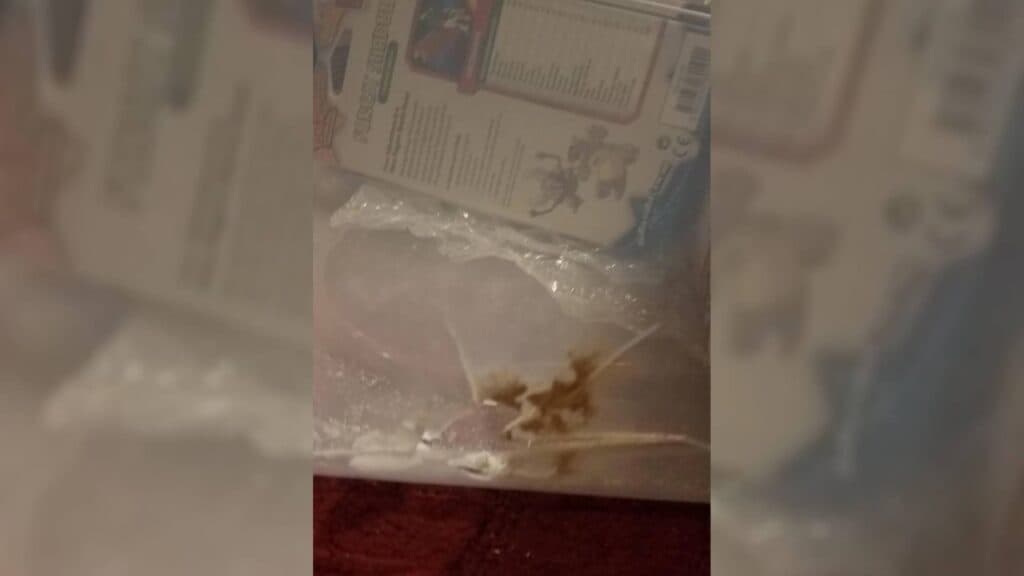 The Tupperware that took the stray bullet. (Image via LolaInSlacks88 on Reddit)