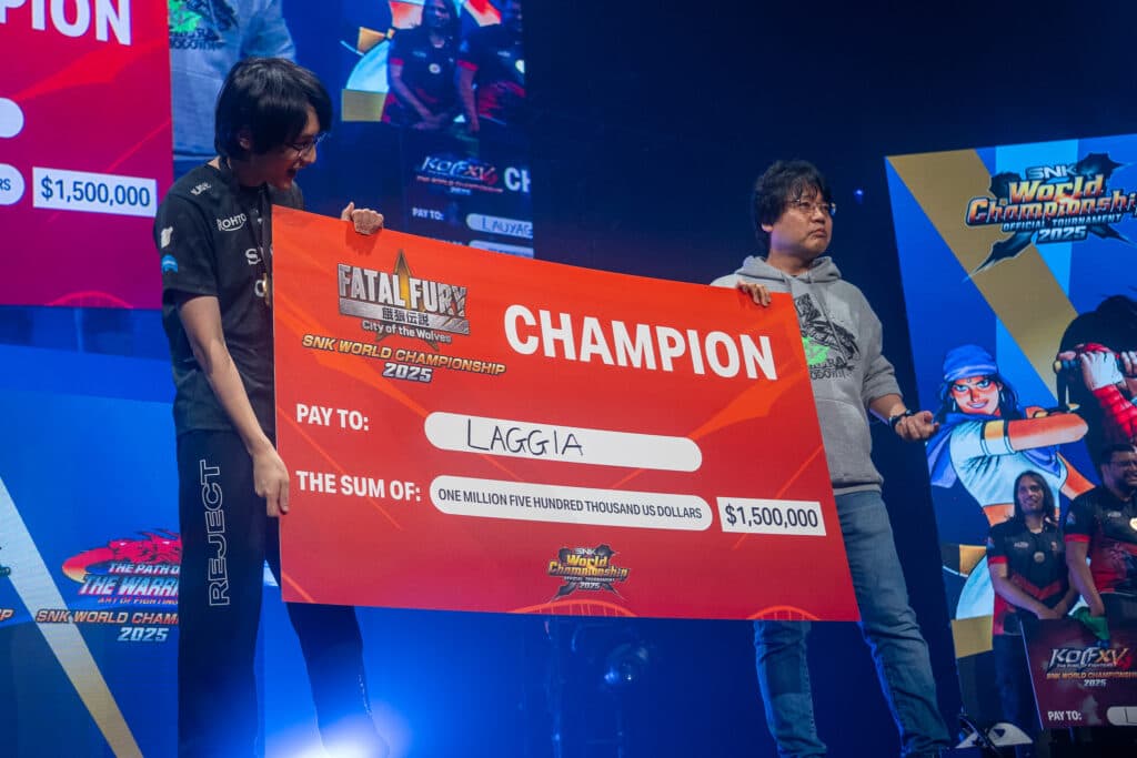Laggia and his big money check (Photo via SNK)