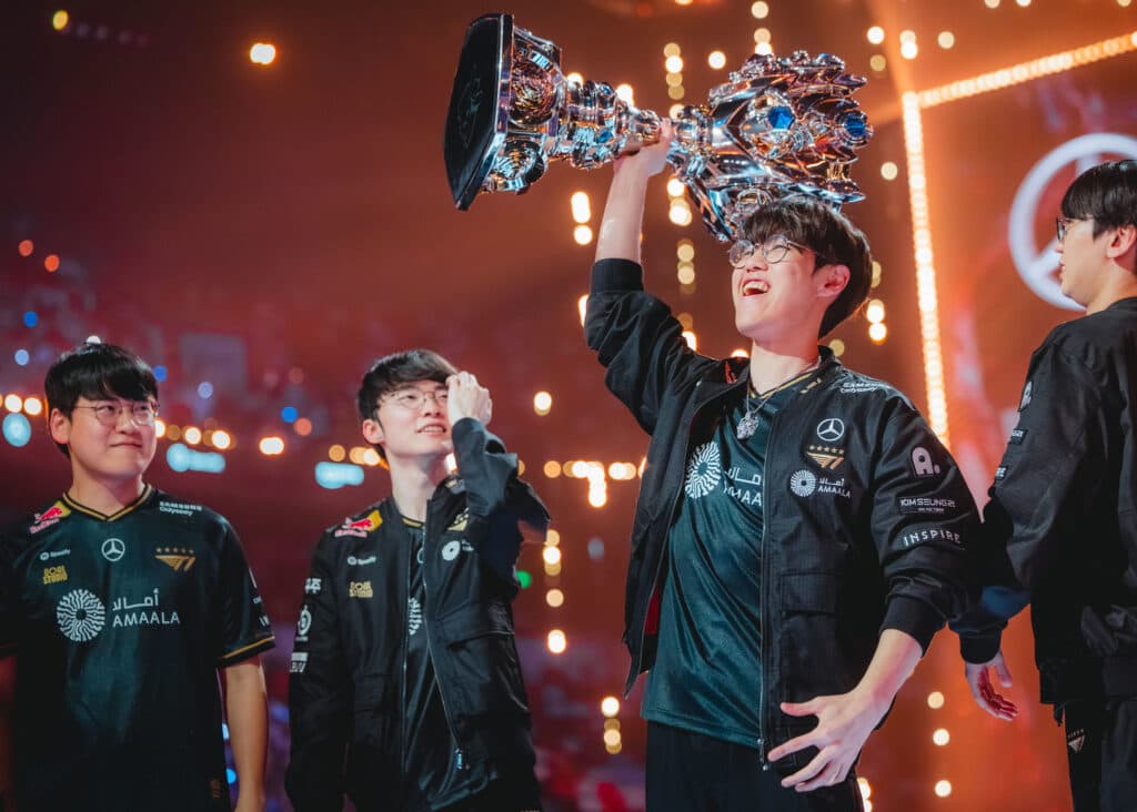 T1 with the Worlds 2025 trophy (Image via Riot Games | Colin Young-Wolff)