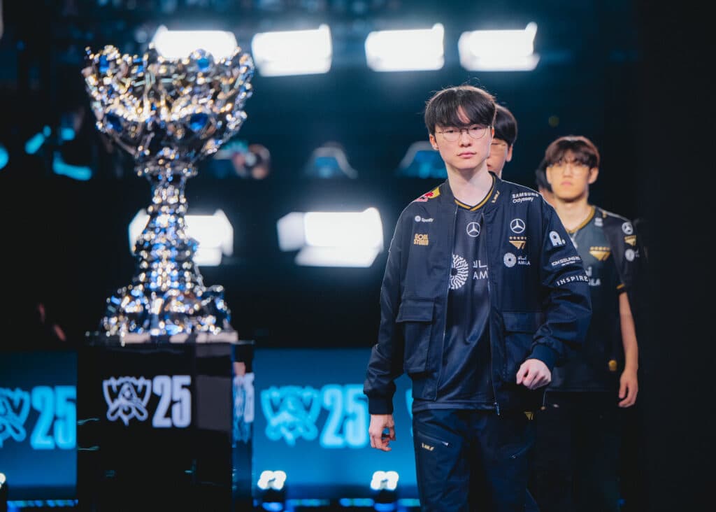T1 on the stage during the LoL Worlds 2025 semifinal (Photo via Riot Games | Colin Young-Wolff)