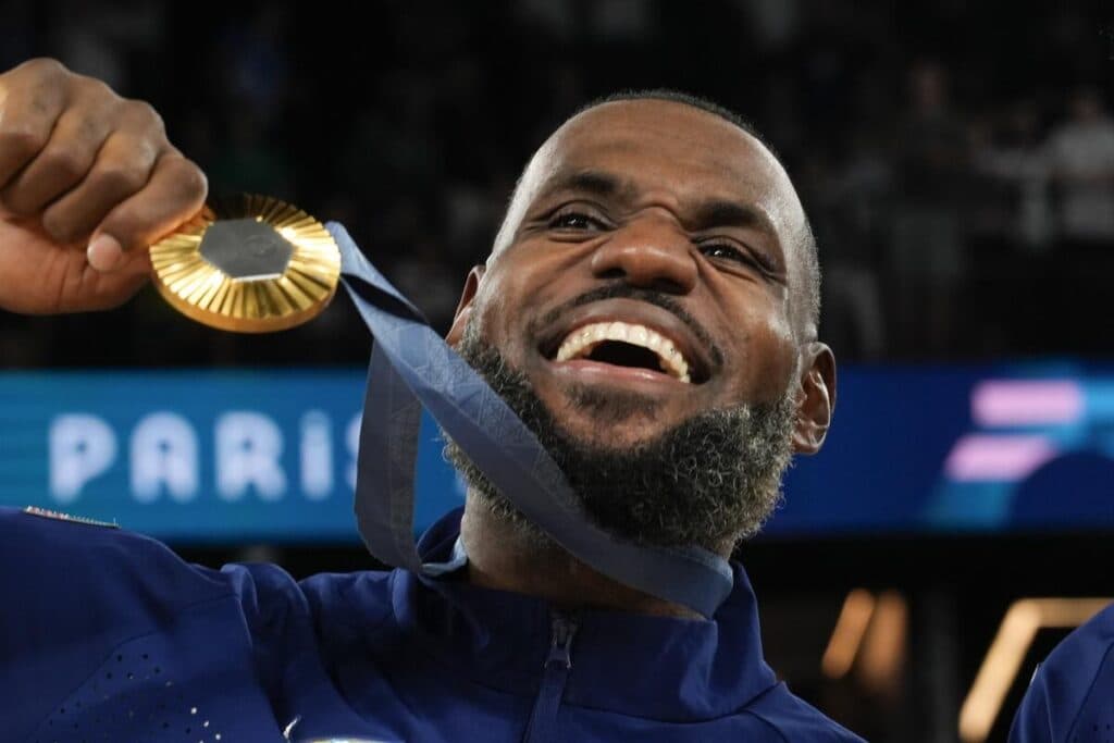 LeBron James at the 2024 Summer Olympics in Paris (Image via Rebecca Blackwell / Associated Press)<br><a href="https://www.latimes.com/people/bill-plaschke"></a><br><br>