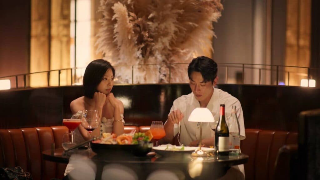 Kim Go-eun and Jo I-geon in a Paradise hotel (Image via Netflix)